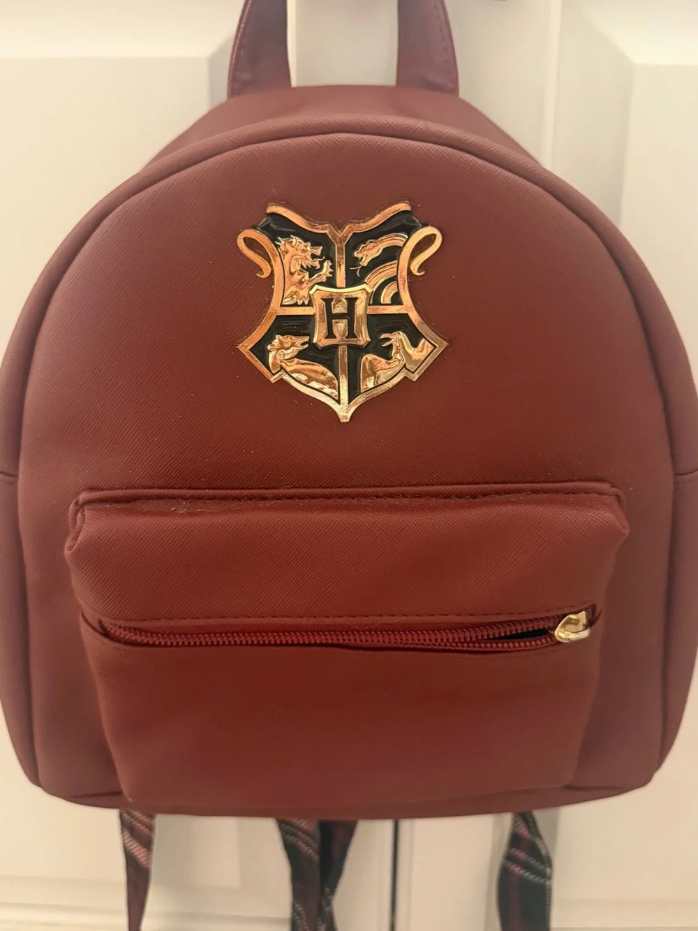 Harry Potter Burgundy Backpack with Gold Logo Crest in Center